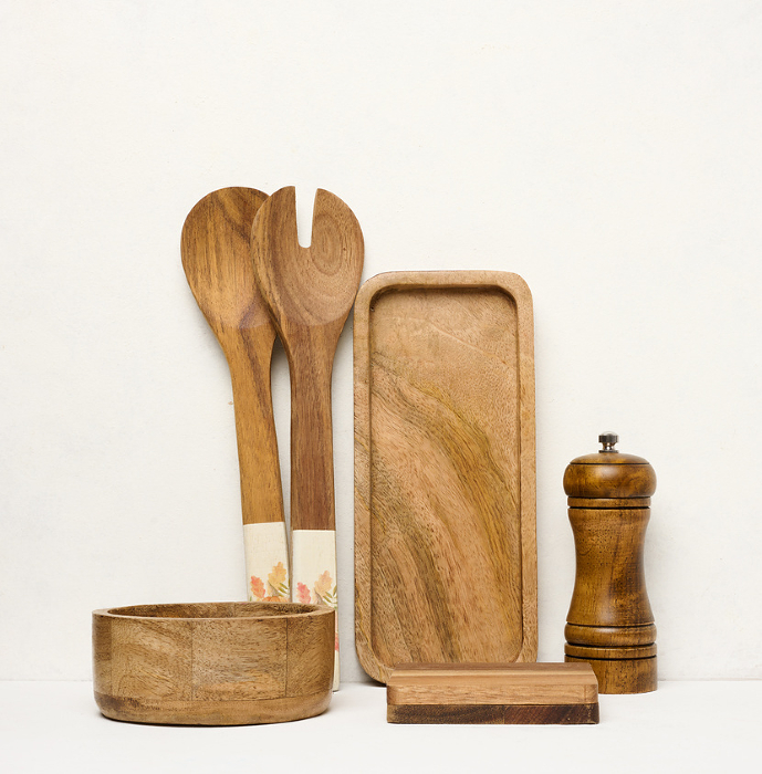 Various wooden kitchen utensils on a white background Various wooden kitchen utensils on a white background