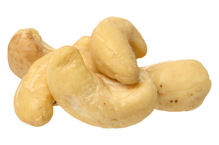 Heap of peeled cashew nuts on isolated background Heap of peeled cashew nuts on isolated background