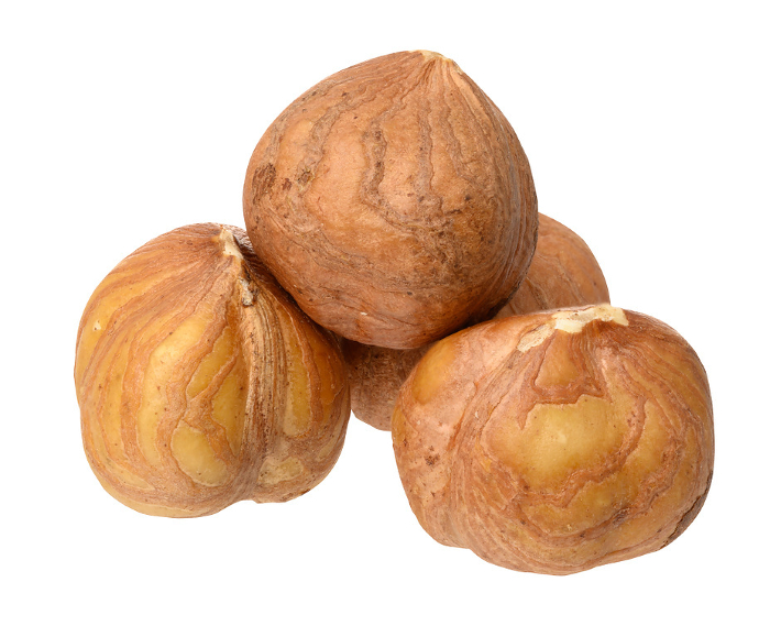 Three hazelnuts on isolated background, close up Three hazelnuts on isolated background, close up