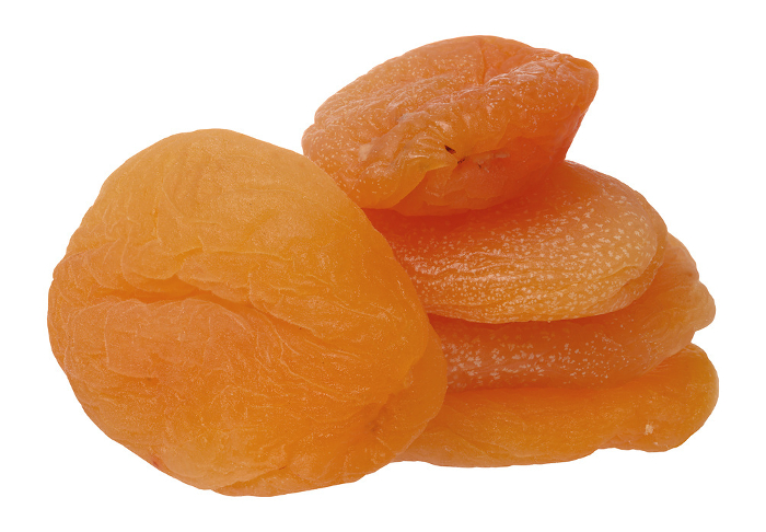 Stack of dried apricots on isolated background, close up Stack of dried apricots on isolated background, close up