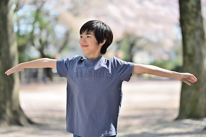 A boy with his arms outstretched