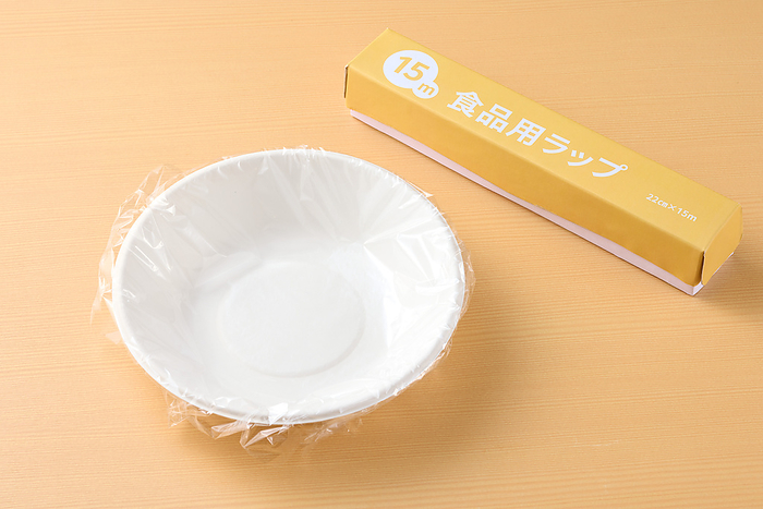 Dish lined with plastic wrap to conserve water
