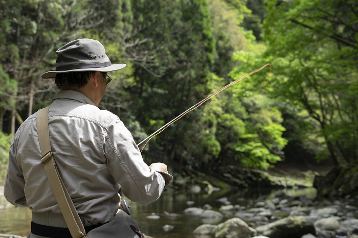 Anglers standing in a mountain stream