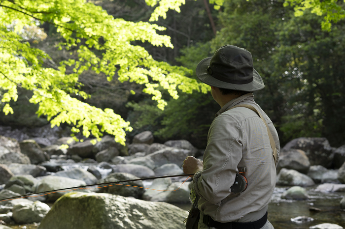 Anglers standing in a mountain stream