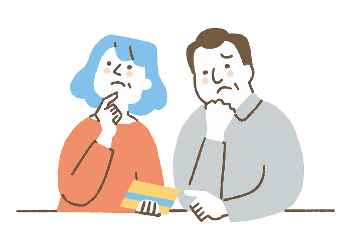 A couple who look at their bankbook and think about their finances_color