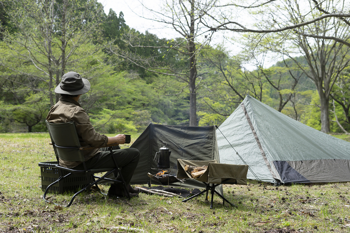 Men enjoying solo camping