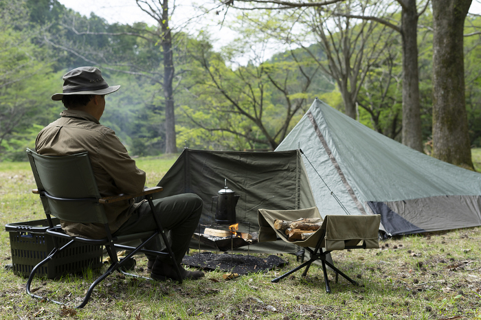 Men enjoying solo camping