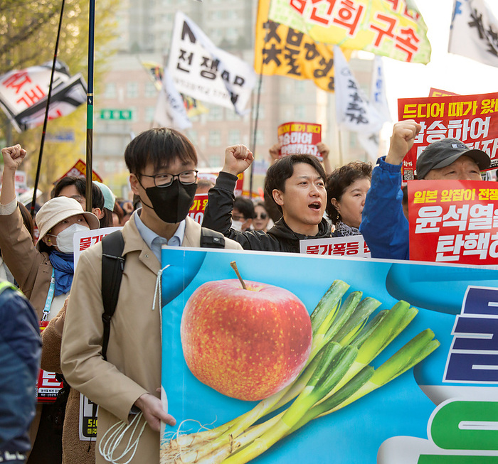 South Koreans demand the impeachment of President Yoon Suk Yeol at a rally in Seoul Protest demanding the impeachment of President Yoon Suk Yeol, Apr 6, 2024 : People attend a rally demanding the impeachment of President Yoon Suk Yeol in Seoul, South Korea. The photo of green onions on a placard makes a parody of Yoon who aroused anger by finding the price tag of 875 won   0.65  for a bunch of green onions a  reasonable price  at a grocery store in March. The 875 won   0.65  was a temporary discount price offered due to a government subsidy and the average retail prices of green onions was about 3,000 to 4,000 won   2.2 to 2.9  for weeks, which was some of the highest levels over the years. The prices of foods and daily necessities are surging rapidly in Korea, local media reported. Pickets read, Sharp price rise. Bankrupt livelihoods of the public. Let s put Yoon Suk Yeol to rout   and  It s time for us to vote. Let s win the April 10 Parliament Election by a landslide to impeach Yoon  .  Photo by Lee Jae Won AFLO 