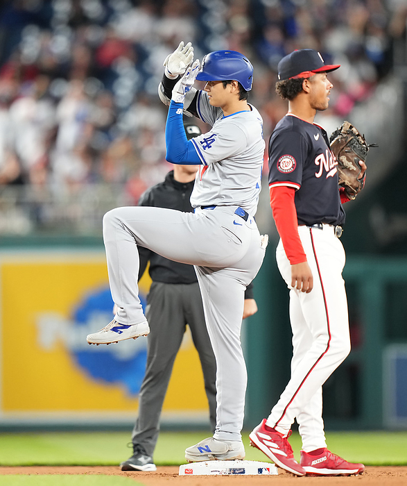 2024 MLB Ohtani 2nd double of the day Nationals vs. Dodgers: Shohei Ohtani  left  poses after giving up a timely double to right center with two outs in the 8th inning for the Dodgers.