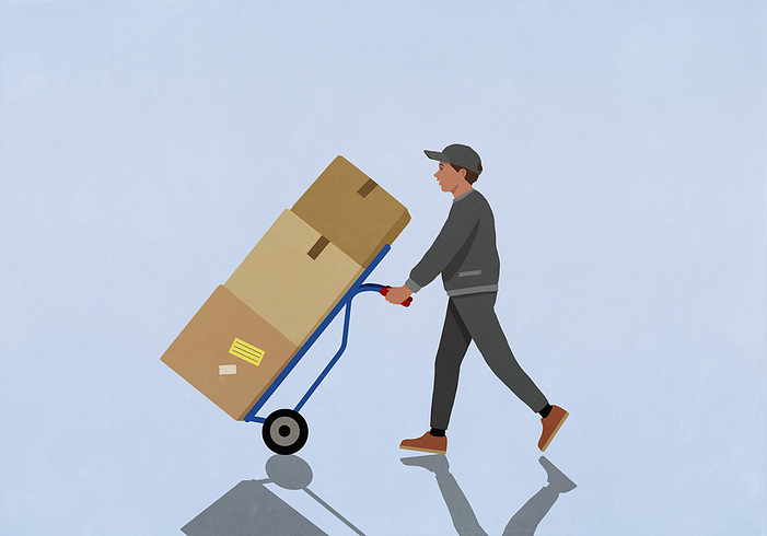 Delivery man pushing hand truck with cardboard boxes, delivering packages