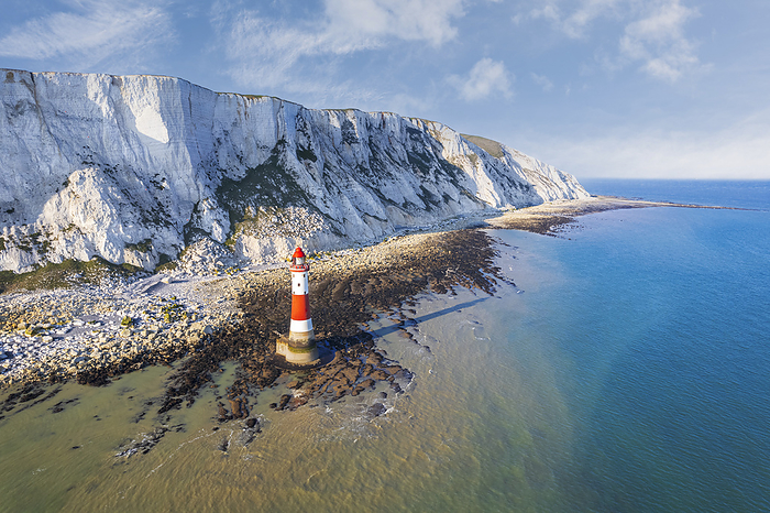Beachy Head lighthouse and chalk white cliffs, aerial view, Seven Sisters Country Park, South Downs National Park, Sussex, England, United Kingdom, Europe