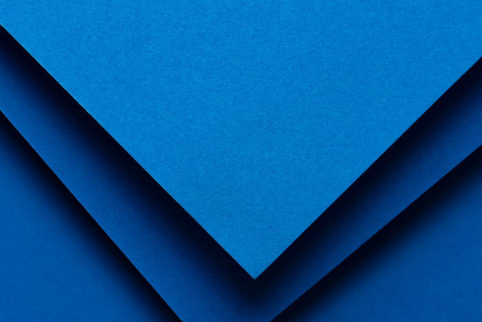 Overlapping blue construction paper background