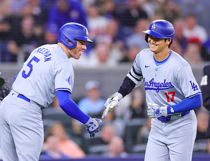 2024 MLB Otani hits No. 7 solo home run  Blue Jays Dodgers Otani is greeted by Freeman  left  after giving up a solo shot in the first inning  photo by Takahiro Mitsuyama .