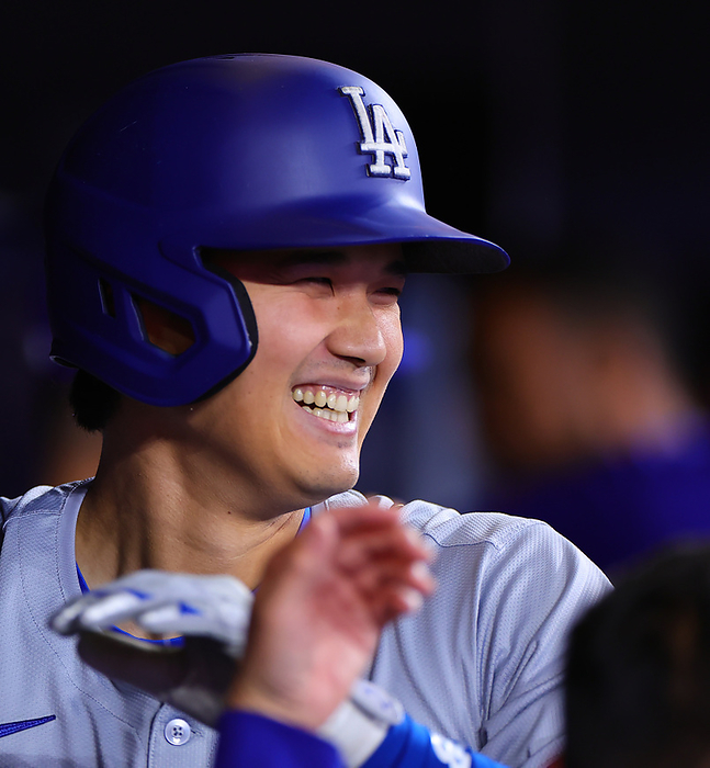 2024 MLB Otani hits No. 7 solo home run  Blue Jays Dodgers Otani smiles as he is greeted by the nine after his first solo shot in the first inning  Photo by Takahiro Mitsuyama  Photo Date 20240426