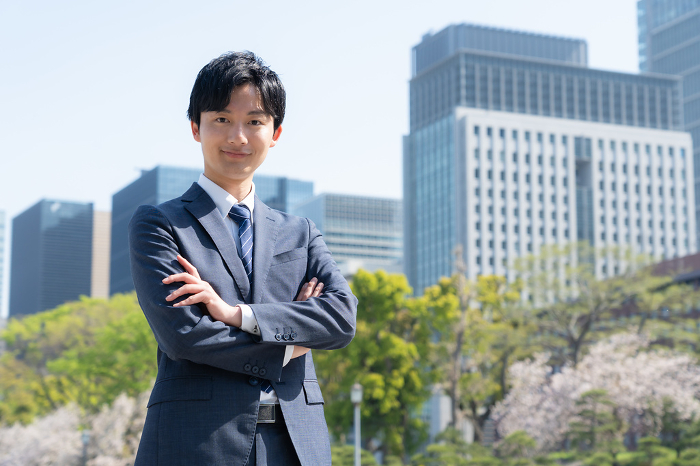 Young Japanese businessman working in an office district (People)