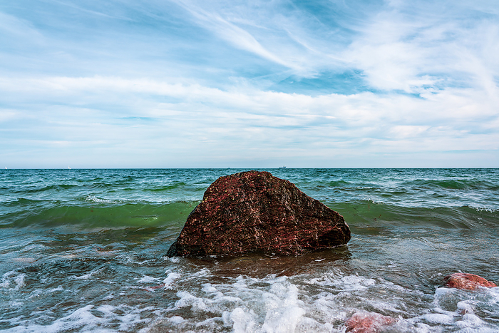 A rock in the Baltic Sea on the beach of Damp. A rock in the Baltic Sea on the beach of Damp., by Zoonar Bernhard Klar