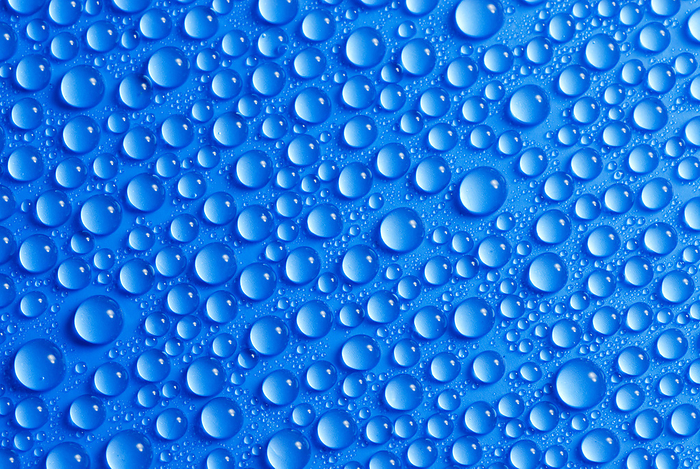 many small water drops on a blue surface many small water drops on a blue surface, by Zoonar Dirk v. Malli
