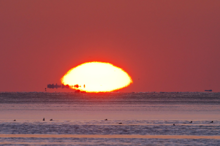 Sunrise and drift ice in Nemuro Bay, Hokkaido  7 degrees Celsius, floating ice floes are visible