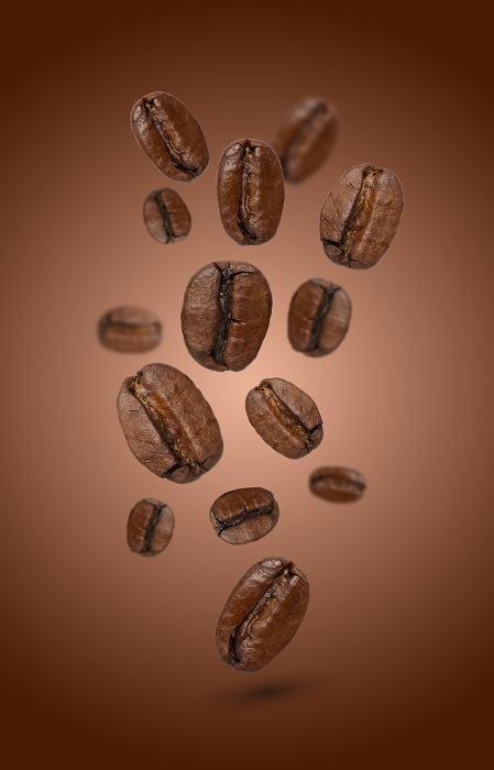 Levitating coffee beans on a brown background Levitating coffee beans on a brown background