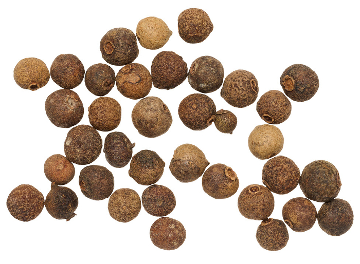 Dry allspice on isolated background, close up Dry allspice on isolated background, close up