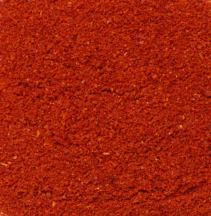Texture of smoked ground red paprika, full frame Texture of smoked ground red paprika, full frame
