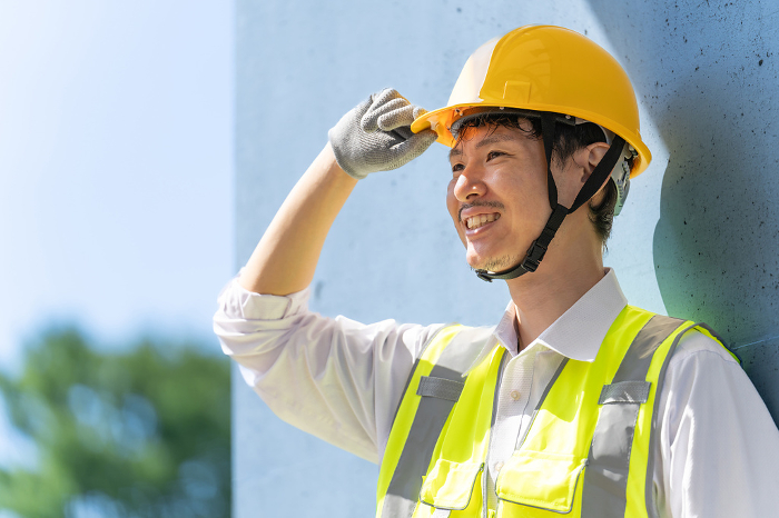 Smiling male worker with helmet, Japanese businessman (People)