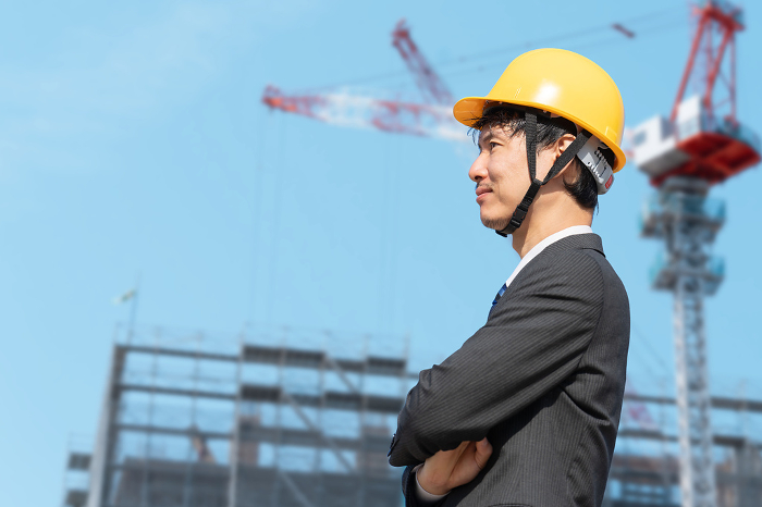 Japanese male site supervisor wearing helmet (construction/construction) (People)