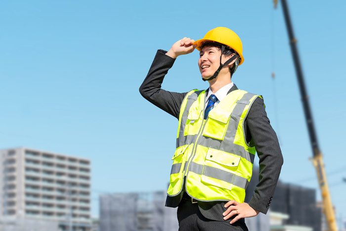 Japanese male site supervisor wearing helmet (construction/construction) (People)