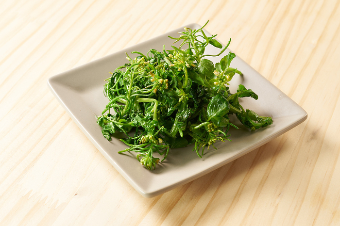 Sauteed watercress with flowers