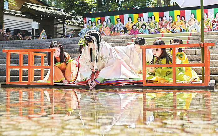 Saioji purifies himself by dipping his hands into the Mitarashi Pond in the  Misogi Ceremony. The Saioji purifies himself by dipping his hands into the Mitarashi Pond during the Misogi ritual at Shimogamo Shrine in Sakyo Ward, Kyoto City.