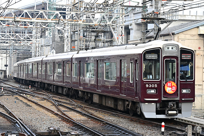 Series 9300 Limited Express Train  with Hatsumode head mark  entering a station of Hankyu Railway, Osaka Taken at Awaji Station