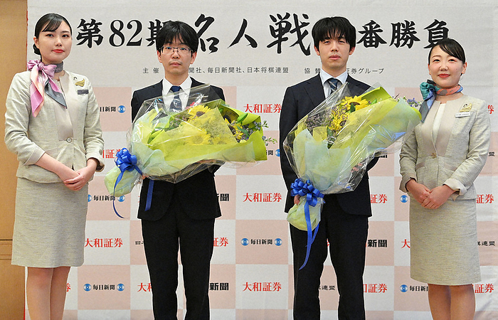 The 82nd Meijin Tournament   7th game   eve of the 3rd game Sota Fujii Meijin  center right  and Masayuki Toyoshima 9 dan  left  pose for a commemorative photo on the eve of the third game of the 82nd Meijin Tournament, at Haneda Airport on May 7, 2024, at 6:14 p.m. Photo by Ririko Maeda