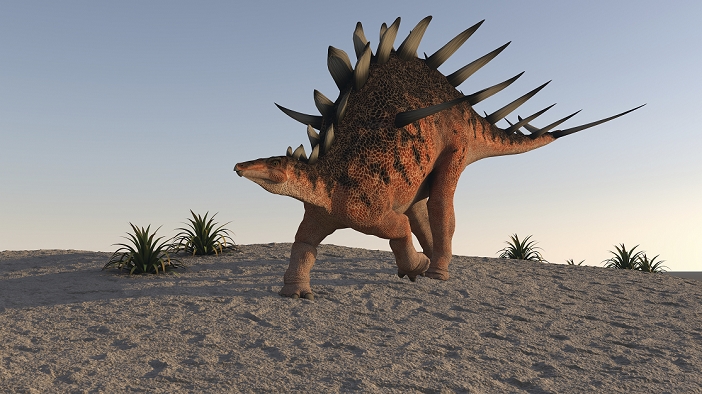 Kentrosaurus walking on sandy terrain.