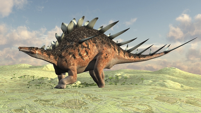 Kentrosaurus walking across a barren landscape.