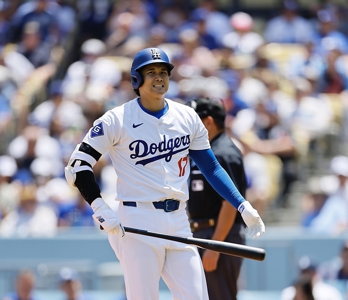 2024 MLB Dodgers vs. Marlins: With two outs in the bottom of the third inning, Shohei Ohtani of the Dodgers strikes out swinging and looks frustrated.