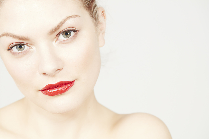 Closeup portrait of a woman with bold red lipstick