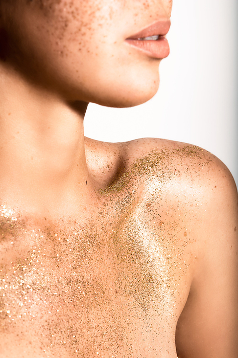 Closeup of a person with glitter on their skin, adding a touch of sparkle