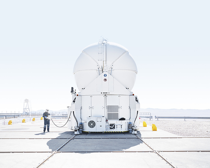 Scientist inspecting telescope at Paranal Observatory in Chile