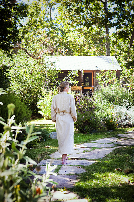 Woman wearing robe in garden
