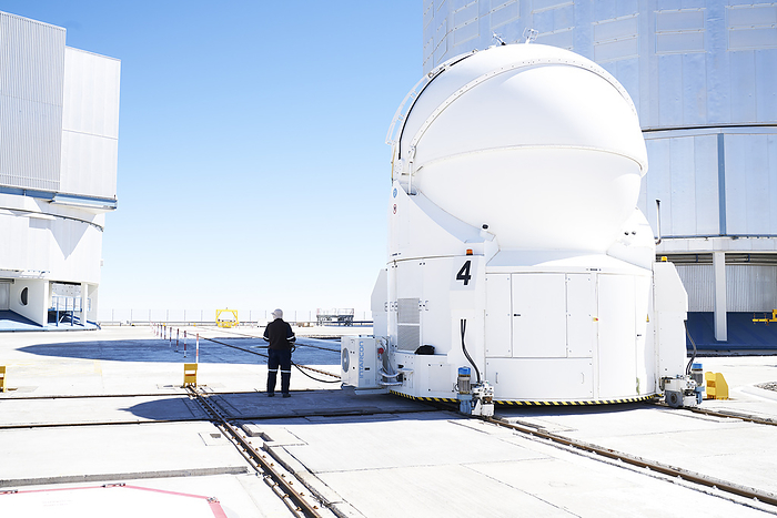 Scientist inspecting telescope at Paranal Observatory in Chile