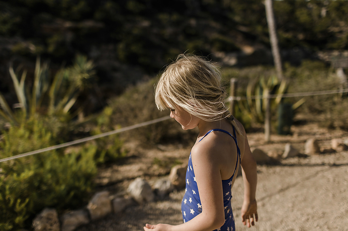 Girl exploring hills at Calo des Moro in Mallorca