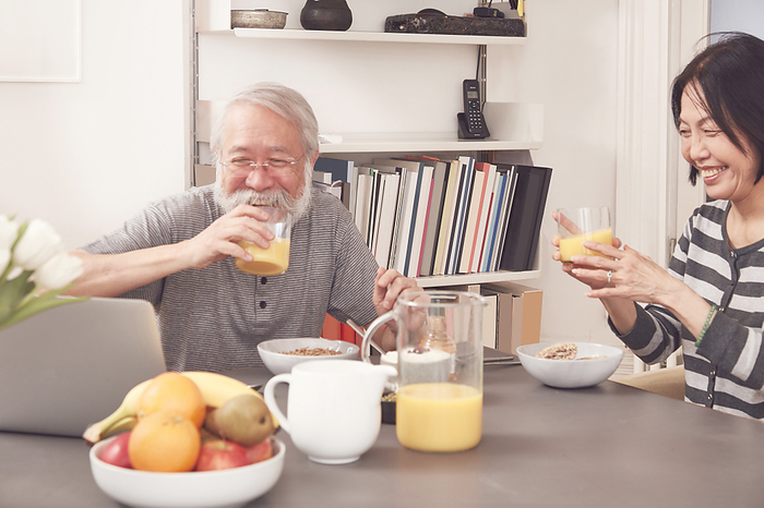 Senior couple enjoying a hearty breakfast together