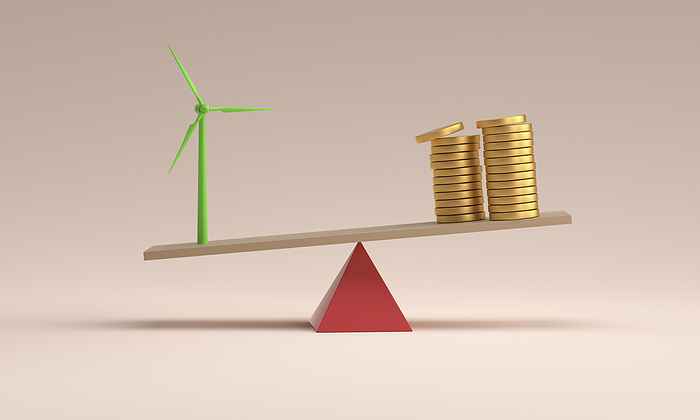 Balance of wind turbine model and money stack against pink background
