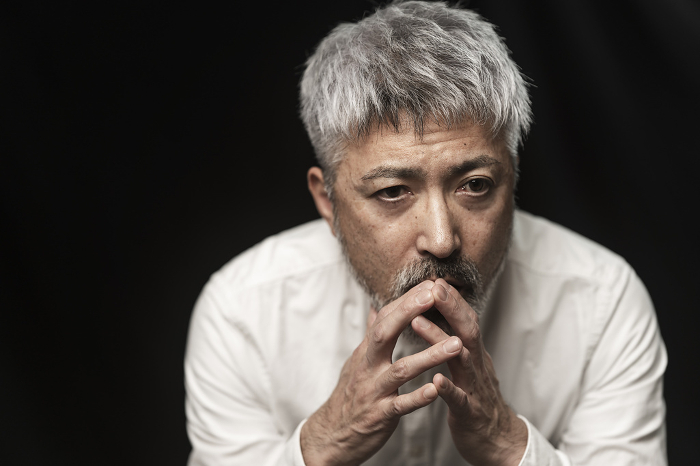 Portrait of Japanese man with gray hair (black background) (People)