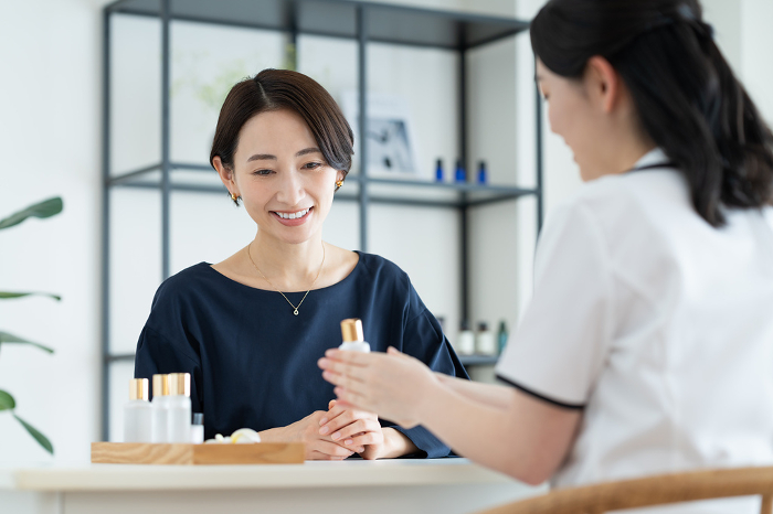 Middle Japanese woman working as a receptionist at a salon (People)