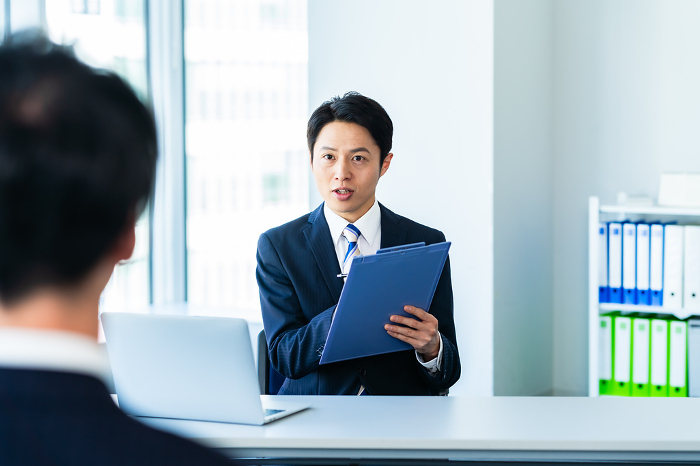 Japanese businessperson interviewing in an office (Male / People)