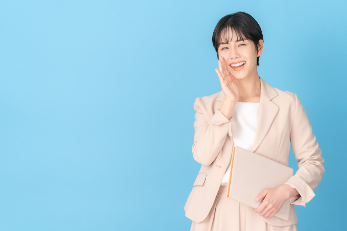 Japanese businesswoman in blue background （Female / People)