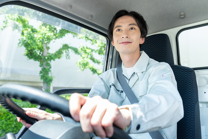 Young Japanese man driving a truck (People)