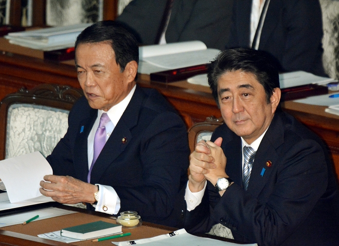 Extraordinary Diet Session Convened Prime Minister Abe Delivers his Policy Statement September 29, 2014, Tokyo, Japan   Japan s Prime Minister Shinzo Abe, right, sits next to Finance Minister Taro Abe before delivering his policy speech as The ruling Liberal Democratic Party hopes to pass bills aimed at facilitating women s active participation in society and reinvigorating local communities. The ruling Liberal Democratic Party hopes to pass bills aimed at facilitating women s active participation in society and reinvigorating local economies while the opposition camp is poised to confront The ruling Liberal Democratic Party hopes pass bills aimed at facilitating women s active participation in society and reinvigorating local economies while the opposition camp is poised to confront the government over the change it made to its constitutional interpretation of the collective right of self defense.  Photo by Natsuki Sakai AFLO  AYF  mis 