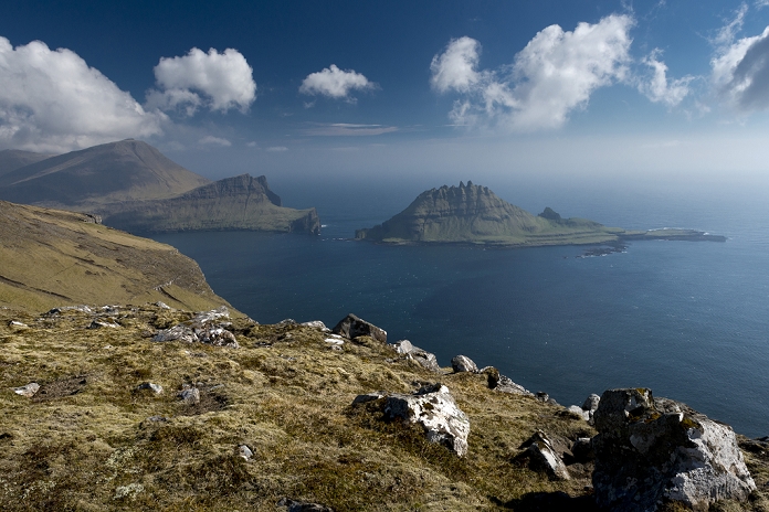Rugged rocks of Tindholmur seen from the hiking trail between Boeur and Gasadalur, Vagar, Faroe Islands, Denmark
